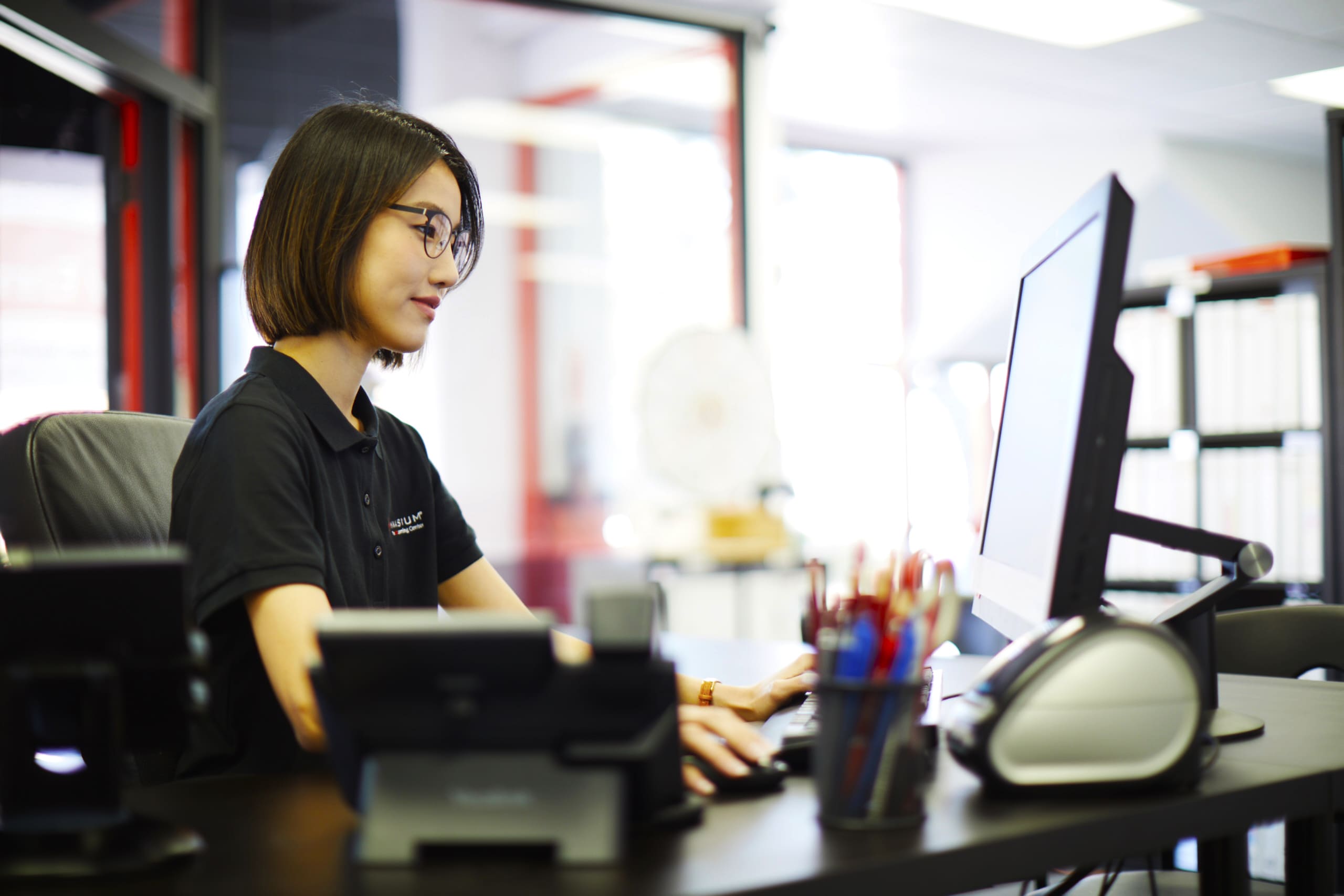 Math tutor at her computer desk.
