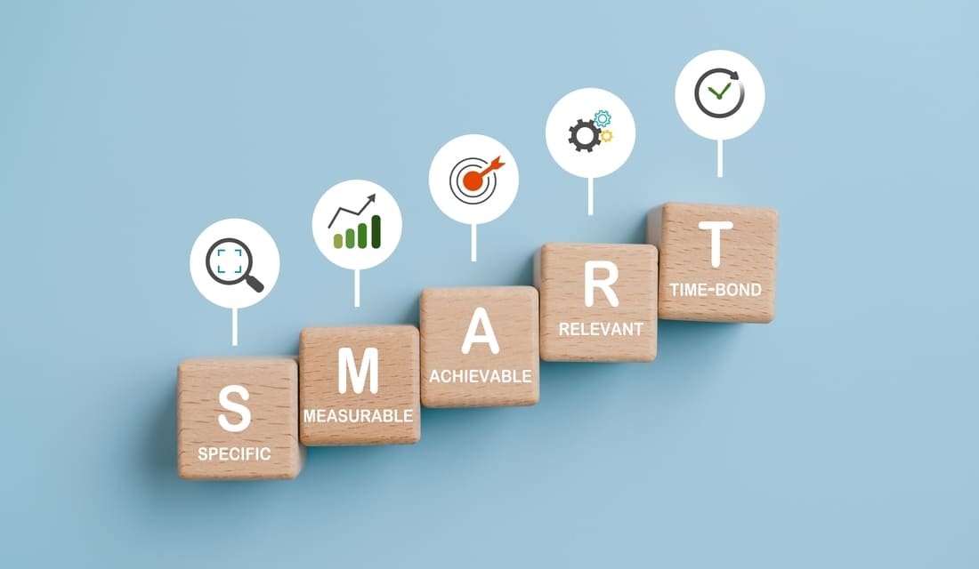 Smart business concept illustrated with wooden blocks arranged on a blue background.