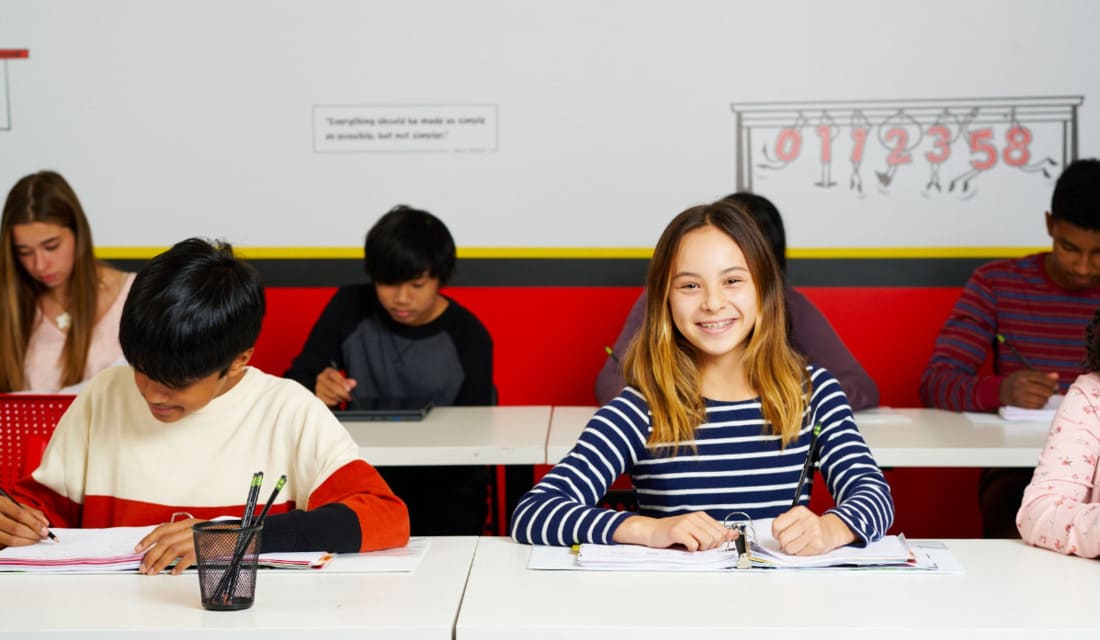 Math students in the classroom working on math problems at Mathnasium of Allen, TX