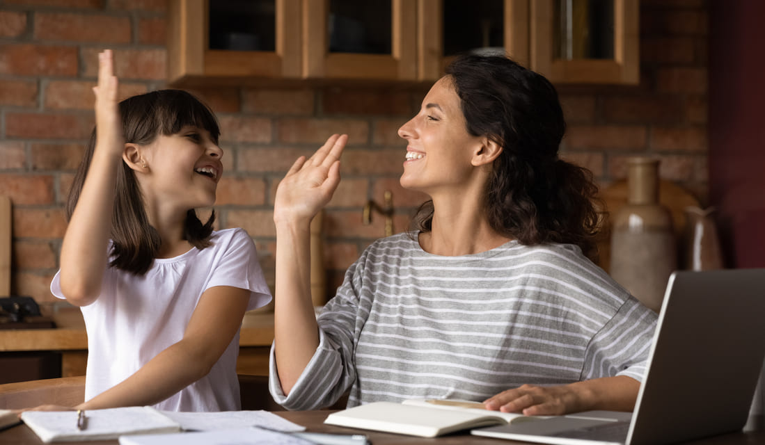 Mother and daughter celebrating after finishing math homework