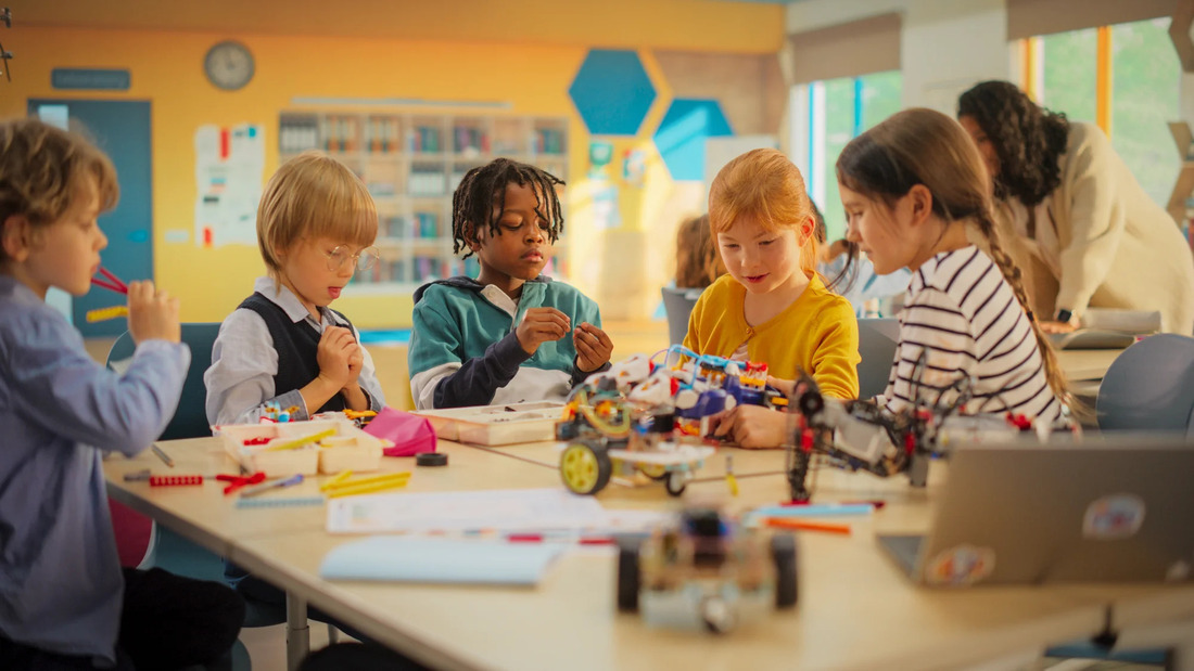 Young students collaborating on LEGO projects, surrounded by educational materials in a cheerful classroom.